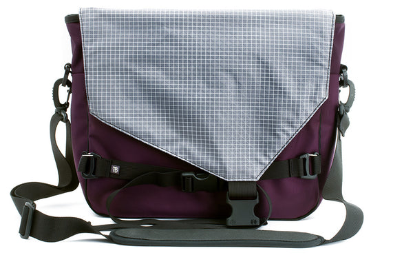 The Maker's Bag in Aubergine (dark purple) 525 Ballistic with a Northwest Sky (light grey with white grid) 200 Halcyon interior.